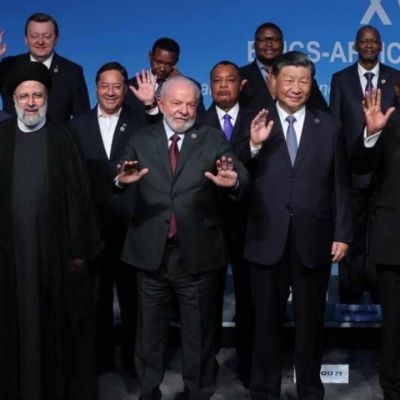 BRICS Plus, with its new members Iran, Egypt, the UAE, Saudi Arabia, and Ethiopia, has emerged as a major player in international logistics and transportation. By controlling key transit routes such as the Suez Canal and the Strait of Hormuz, and developing international corridors like the North-South Corridor, BRICS Plus is redefining global trade flows. This article examines the group’s role in developing transit infrastructure, its impact on global trade, and the challenges it faces.

The Importance of Transit Corridors in Global Trade

Transit corridors, such as China’s Belt and Road Initiative or the North-South Corridor, serve as critical arteries for global trade. These routes enable the efficient and cost-effective movement of goods across continents. BRICS Plus, with members strategically located in key geographic regions, has significant potential to enhance these corridors. For instance, Egypt’s control over the Suez Canal, Iran’s access to the Persian Gulf and Caspian Sea, and Brazil’s key Atlantic ports provide strategic advantages for global logistics development.

Iran’s Role in Transit Corridors

Iran, as a new BRICS member, plays a central role in developing transit corridors. Its geographic position as a bridge between Asia, Europe, and the Middle East facilitates the integration of East-West and North-South trade routes. The North-South Corridor, stretching from India to Russia via Iran, is a flagship project for BRICS Plus. This corridor can significantly reduce transit time and costs between India and Russia, boosting trade between these nations.

Additionally, Iran’s development of ports like Chabahar provides access to the Indian Ocean, serving as a gateway for Indian and Chinese goods to reach Middle Eastern and European markets. Iran’s expanding railway infrastructure, part of the 382,000-kilometer BRICS rail network, further enhances the group’s transport capacity.

BRICS Plus Logistics Cooperation

BRICS Plus is focused on developing transport infrastructure to enhance its global competitiveness. For example, Russia’s proposal to establish a BRICS grain exchange could stabilize pricing and boost intra-group grain trade. In 2023, BRICS countries produced 1.17 billion tons of grain, accounting for 42% of global production. With new members, this figure has risen to 1.24 billion tons.

Moreover, BRICS Plus is working to create a network of transport routes independent of Western-controlled pathways. This is particularly critical given Western sanctions that have disrupted traditional trade routes. For instance, oil sanctions on Russia and Iran have pushed these countries to develop alternative transit corridors.

Logistical Challenges

Despite its potential, BRICS Plus faces logistical challenges. Some member states, such as Ethiopia, lack sufficient port infrastructure despite their strategic location in the Horn of Africa. Additionally, political and economic tensions, particularly between China and India, could hinder logistics cooperation. External pressures, such as US tariff threats in 2025, may also discourage investment in transit projects by some members.

Impact on Global Trade

The development of transit corridors by BRICS Plus could reshape global trade dynamics. By reducing reliance on Western-controlled routes like the Panama Canal or the Strait of Malacca, BRICS Plus can redirect trade flows toward alternative pathways. This not only boosts intra-group trade but also empowers developing nations to play a more active role in global commerce.

Furthermore, transit corridor development can attract foreign investment. For example, Chinese investments in Iran’s Chabahar port and Egypt’s Suez Canal projects could enhance these countries’ trade capacities. Such investments also create jobs and strengthen local economies.

Conclusion

BRICS Plus is positioning itself as a leader in global trade through its focus on transit corridors and logistics infrastructure. The roles of Iran, Egypt, and other new members are critical to this process, but success depends on overcoming internal and external challenges. By continuing this trajectory, BRICS Plus could emerge as a powerful alternative to the Western-dominated trade system.

Source: Eghtesad Moaser - Strengthening the Interests and Rights of Developing Economies